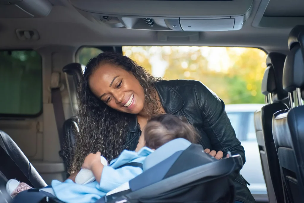 Young child safely strapped into a car seat — how to choose a baby car seat UK guide