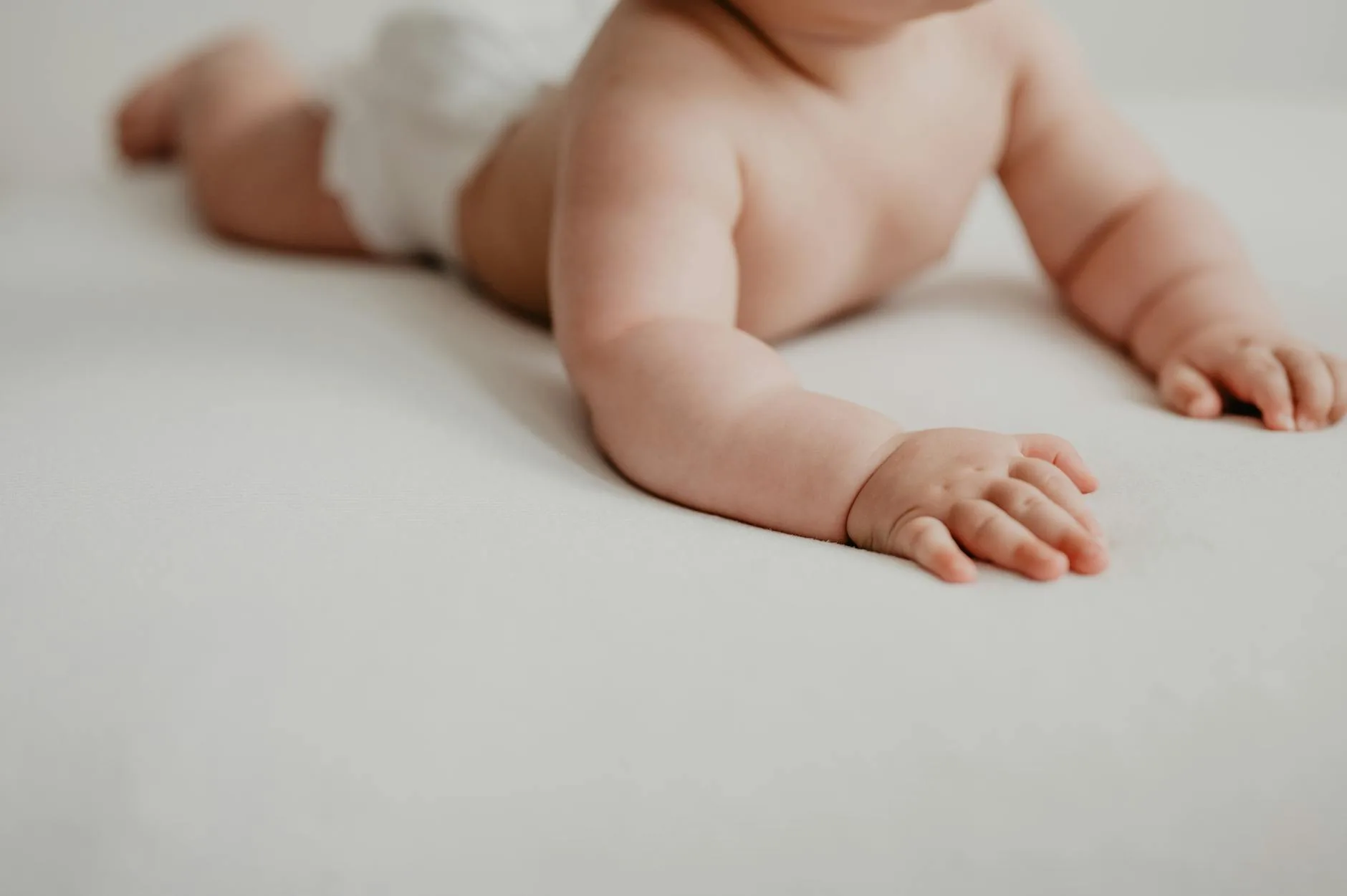 Baby reaching with free hands during development