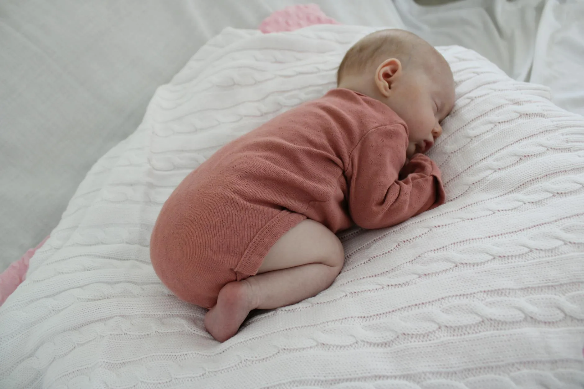 Baby wearing a sleeping bag ready for bedtime