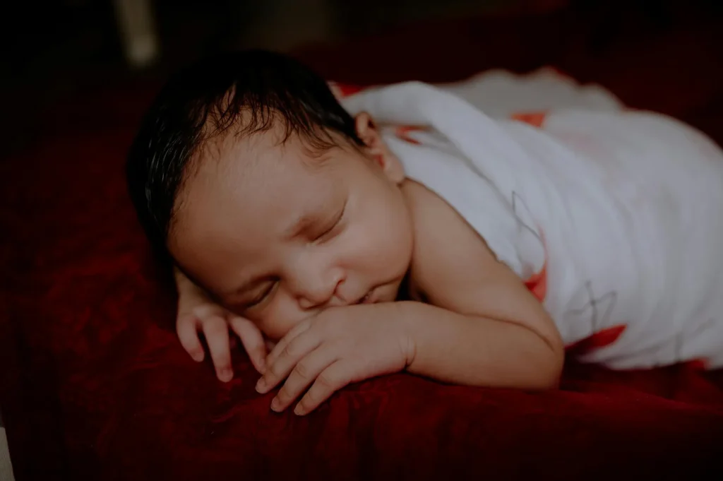 Baby sleeping peacefully in a cot