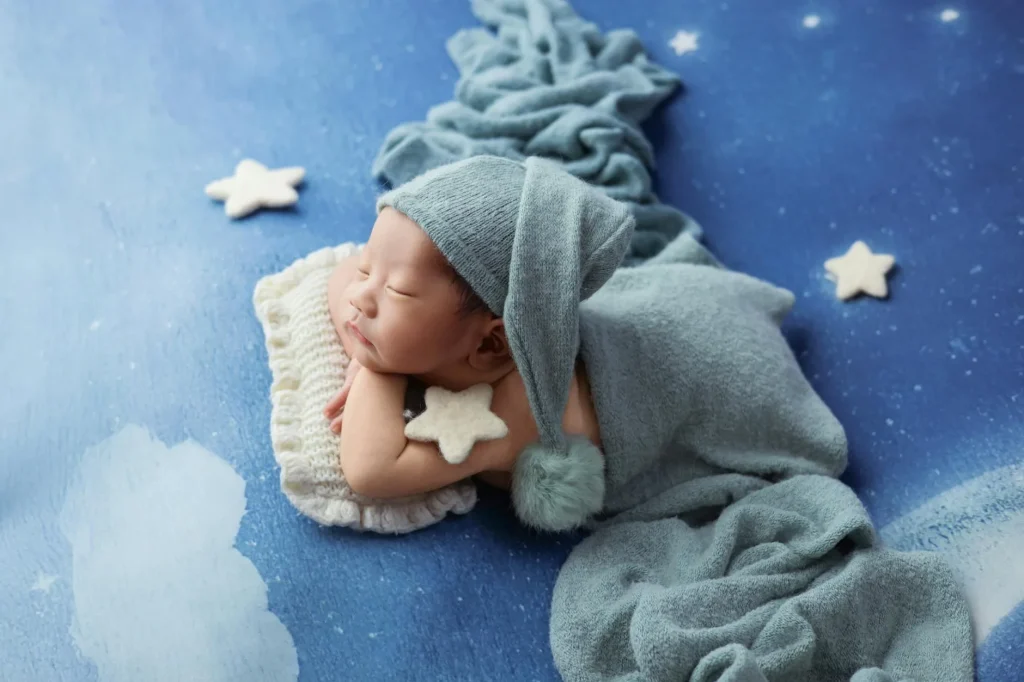 Baby sleeping peacefully in a cot at night
