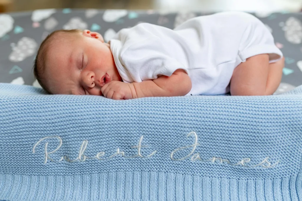 Baby sleeping peacefully in a cot in a nursery