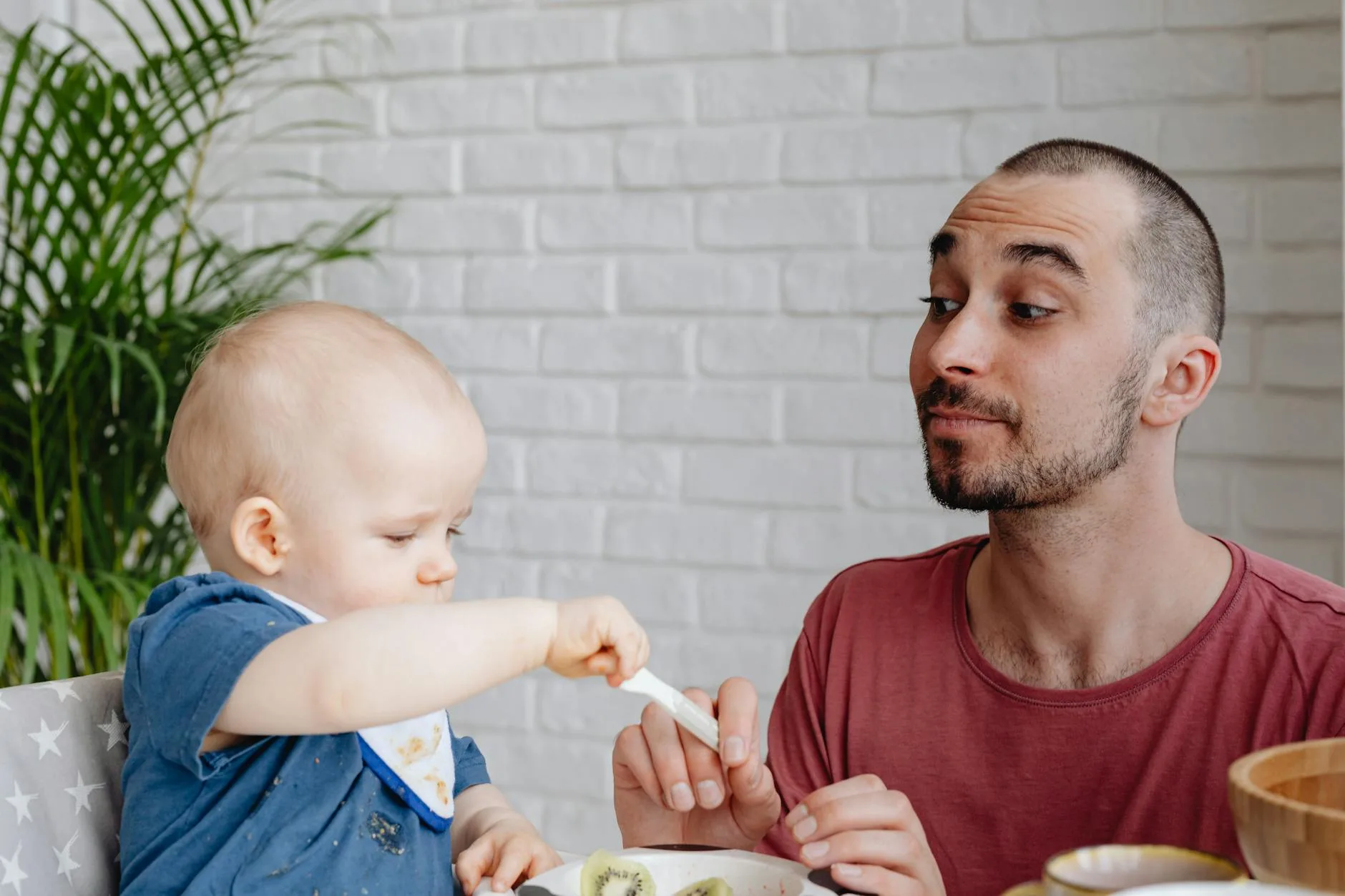 Wooden highchair pulled up to a family dining table