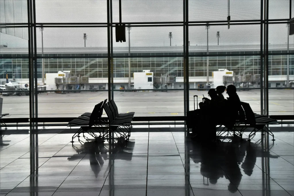 Family with luggage in an airport terminal ready for departure