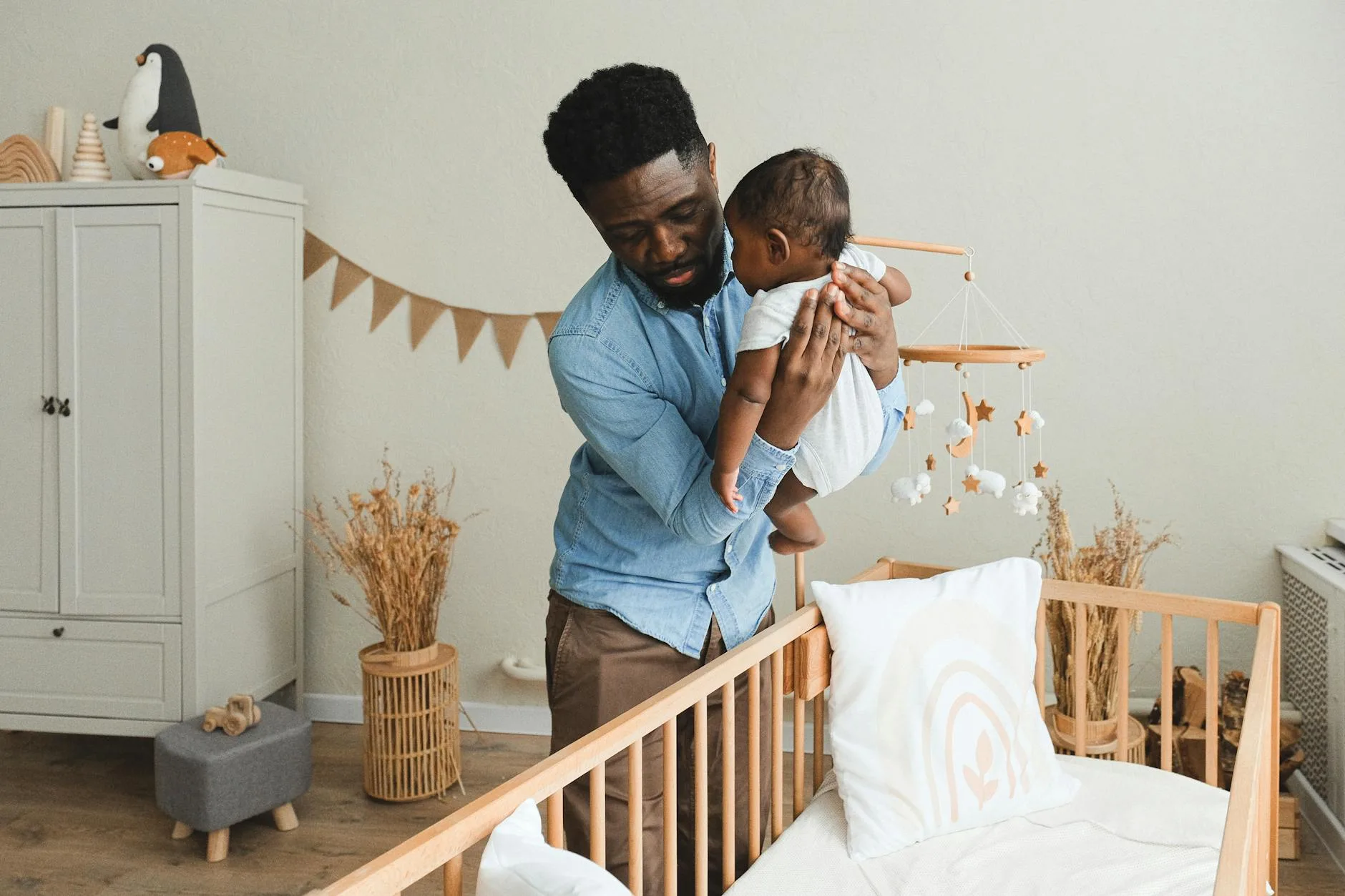 Baby nursery room with crib and monitor setup