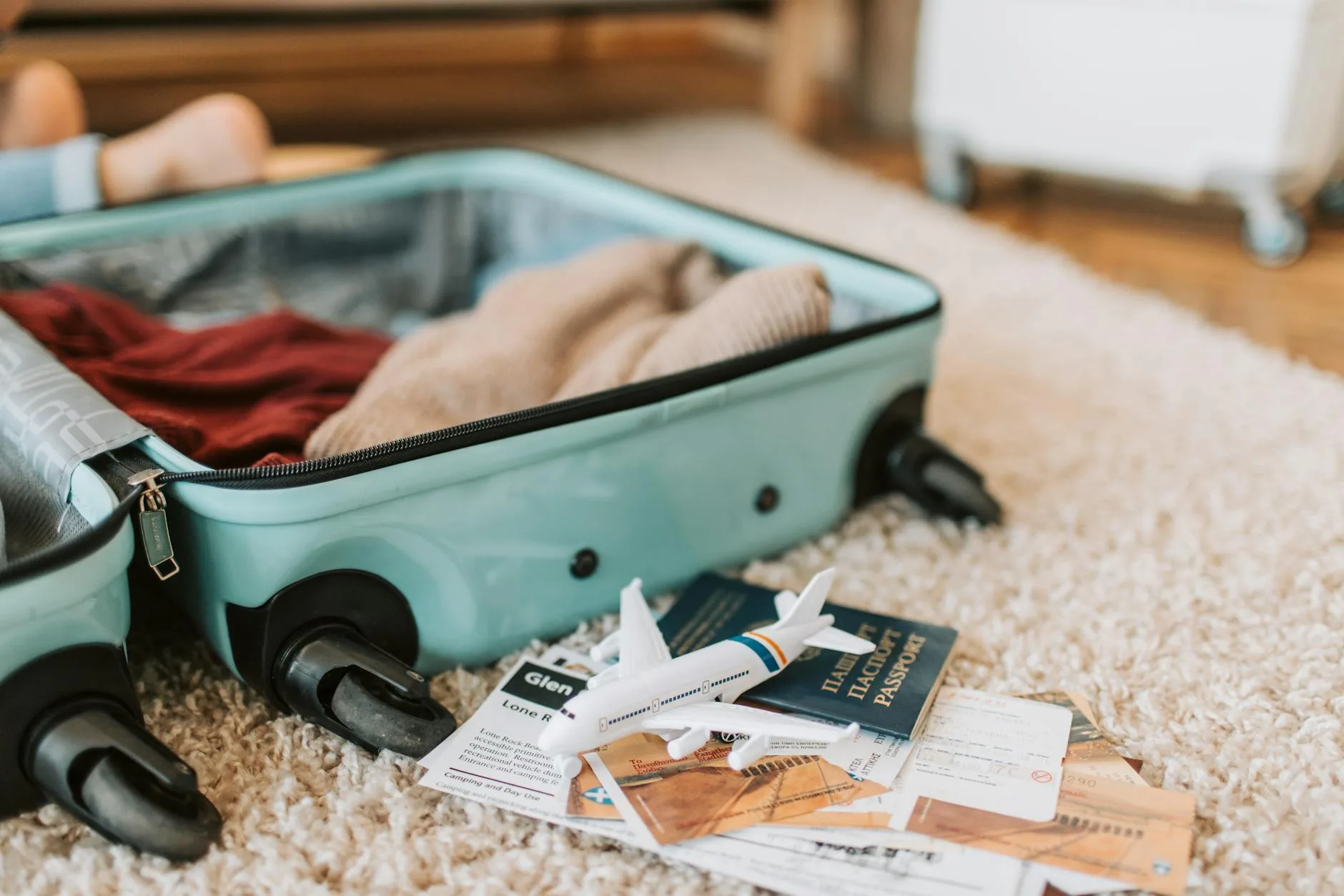 Family travel luggage packed for a flight with pushchair accessories