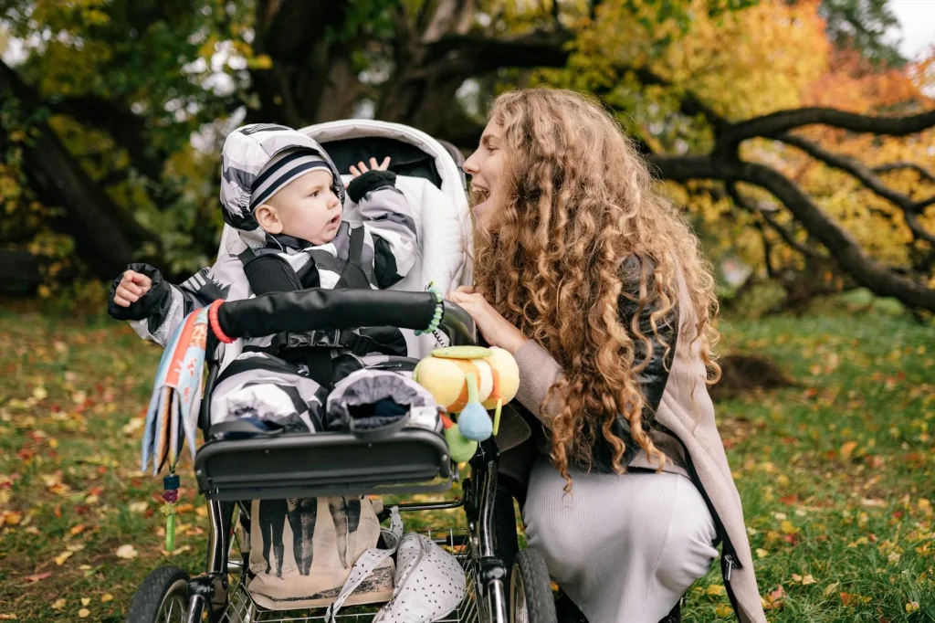 Clean pushchair parked outdoors in a park setting