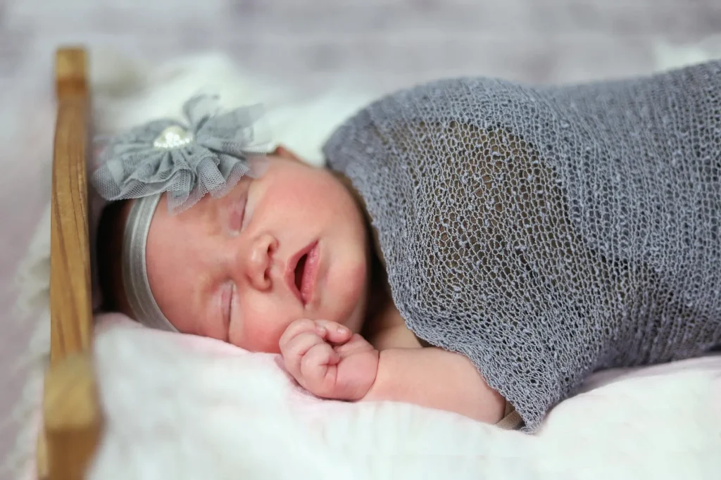 Baby sleeping peacefully in a crib in a nursery