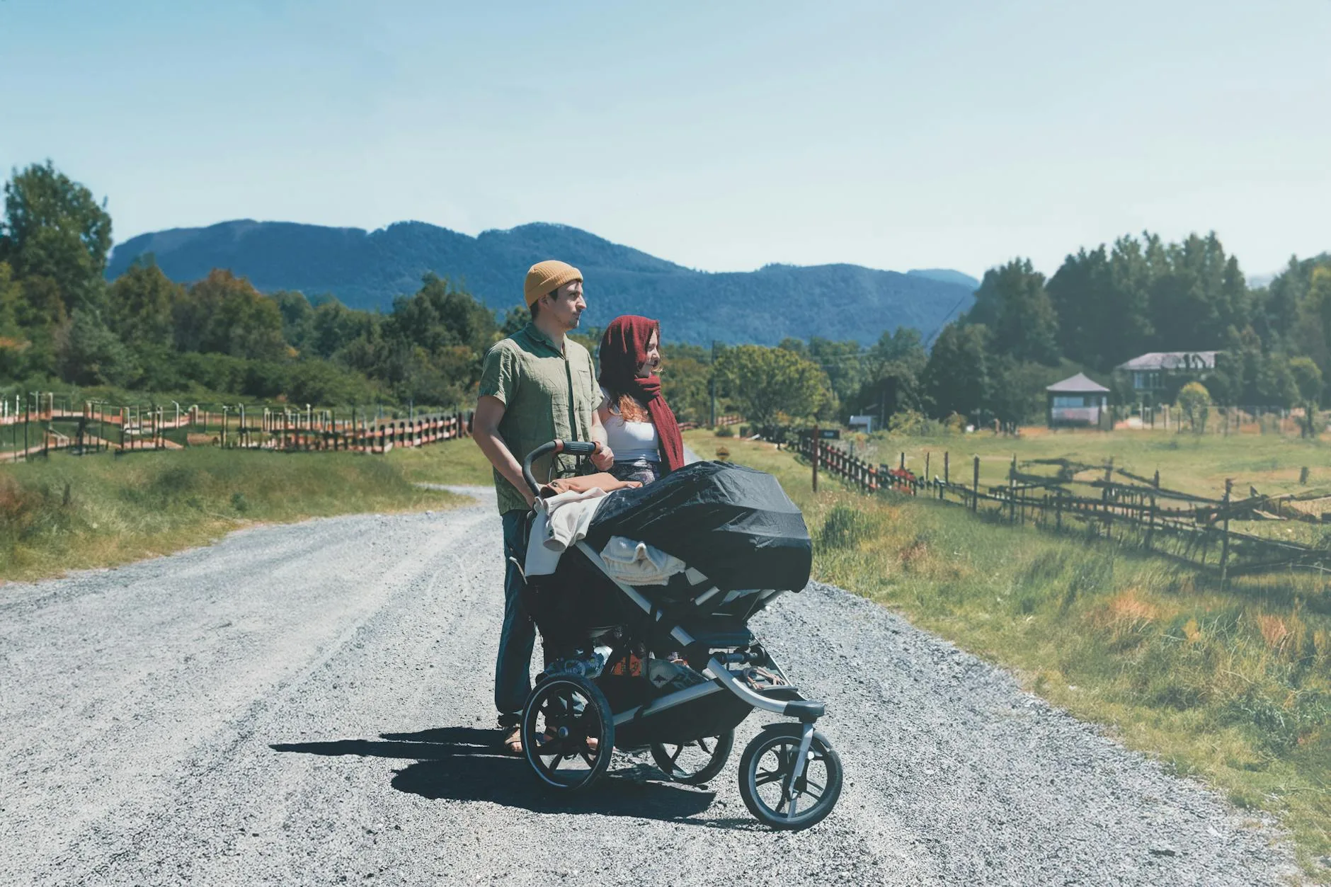 Family walking countryside trail with pushchair