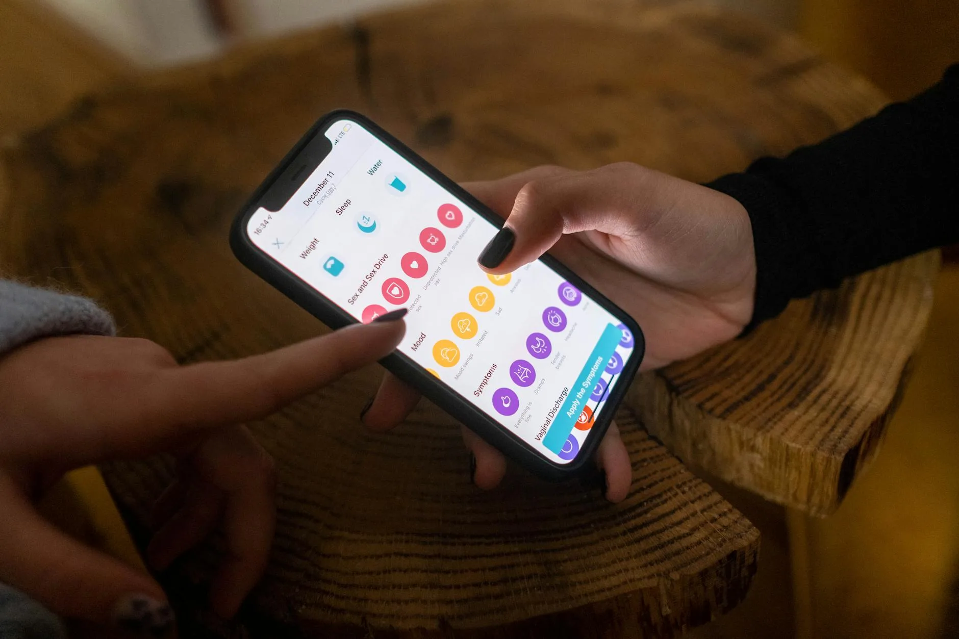 Parent checking baby monitor app on smartphone