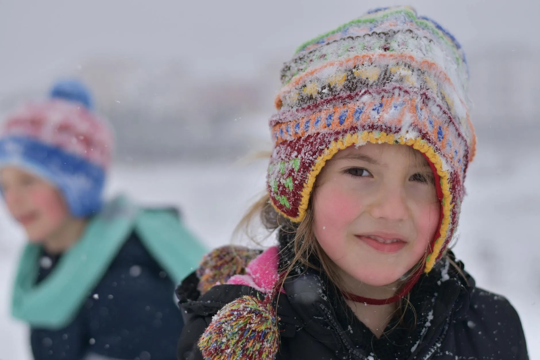 Children in warm winter coats outdoors