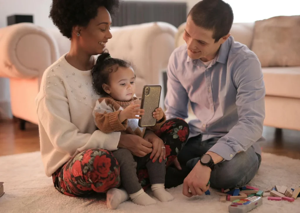Parent checking a Wi-Fi baby monitor app at night